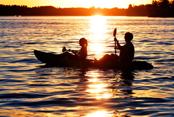 Silhouetted Kayakers