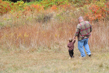 Father and Son walk down the hill