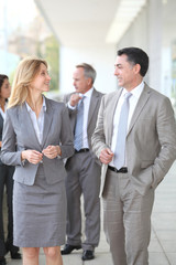 Business people walking outside a congress center