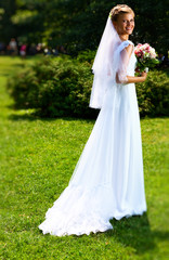 Young bride in park