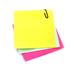 Three reminder notes  with clip isolated on white
