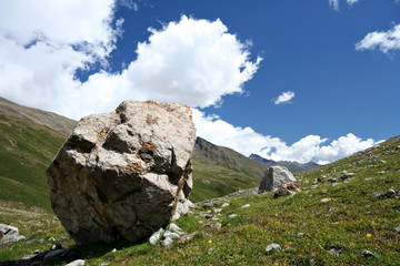 Rocks in valley,Caucasus mountains.Blue sky,clouds