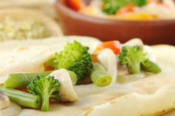 Obraz na płótnie Canvas Vegetables on pancake