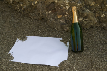 Blank postcard and champagne bottle