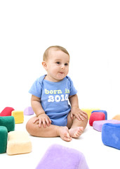 Baby with Toys on White Background.