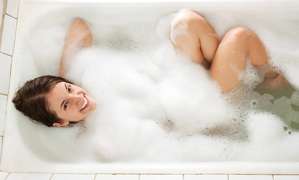 girl sitting in a bath