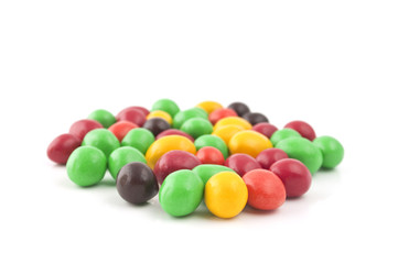 Pills with peanuts covered with multicolored glaze