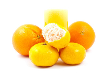 A glass of fresh-squeezed citrus juice with fruits