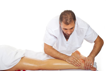 Obraz na płótnie Canvas Masseur give therapeutic massage to woman legs