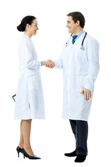 Full body portrait of two medical people handshaking, isolated