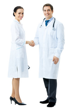 Full body portrait of two medical people handshaking, isolated