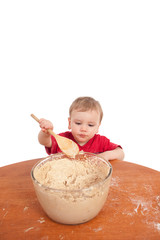 Toddler stirring cake mix