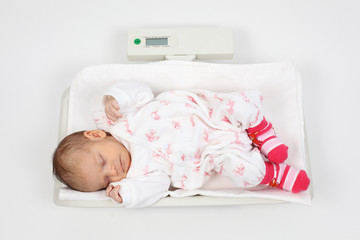Baby sleeping on a balance © philipus