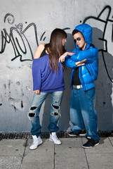 Obraz na płótnie Canvas Young couple urban fashion standing portrait