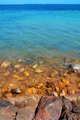 Rocky beach shore turquoise ocean sea