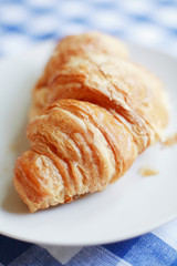 Croissant on breakfast table
