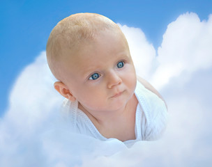 Cute small   boy on a cloud