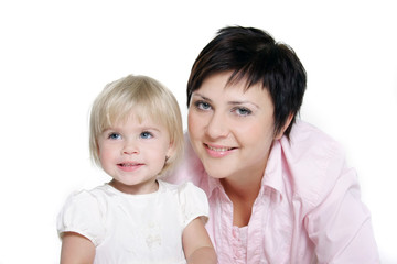 studio portrait of attractive mother and daughter over white