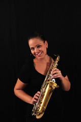 Fototapeta na wymiar Young woman with saxophone