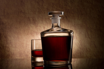 Still life with cognac glass and bottle in box