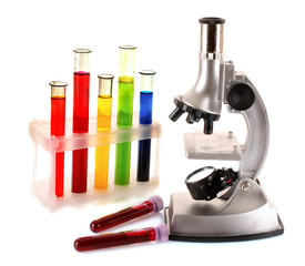 Obraz na płótnie Canvas Laboratory metal microscope and test tubes with liquid isolated
