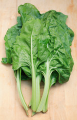 Fresh spinach on chopping board