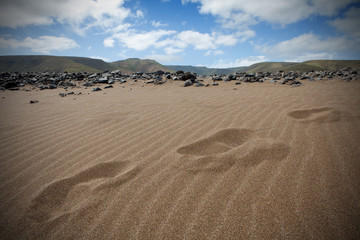 Sandy dunes and footprints