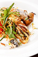 Grilled pork steak with vegetable garnish.