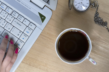 female hand typing on a laptop