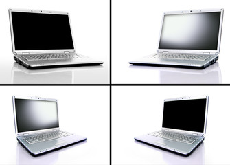 Collection of four silver laptops on white background