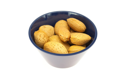almonds in a bowl isolated on white