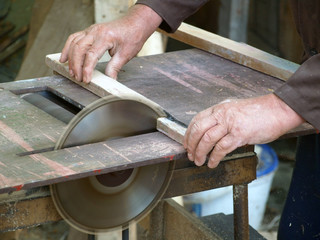 Man with circular saw at work