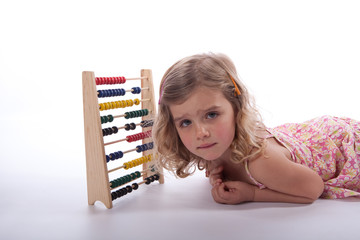 Young girl worrying about abacus