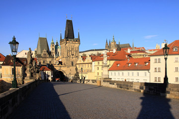 Naklejka na ściany i meble View on the autumn Prague gothic Castle with the Charles Bridge