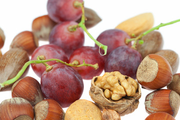 nuts and grapes isolated on white