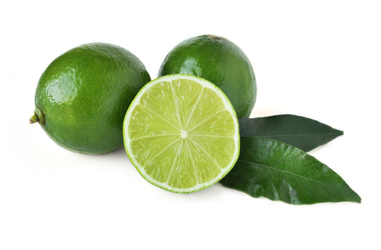 Fresh organic limes isolated on white background