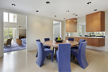 Dining room with lavendar colored chairs