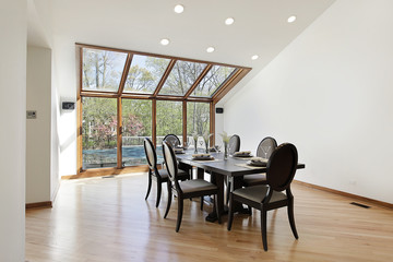 Dining room with wood trimed skylights