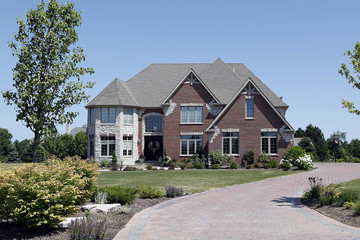 Brick home with white stone turret