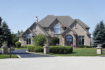 Brick and stone home with cedar roof