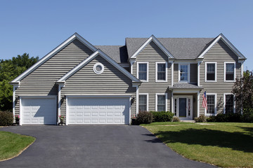 Home with gray siding and covered entry