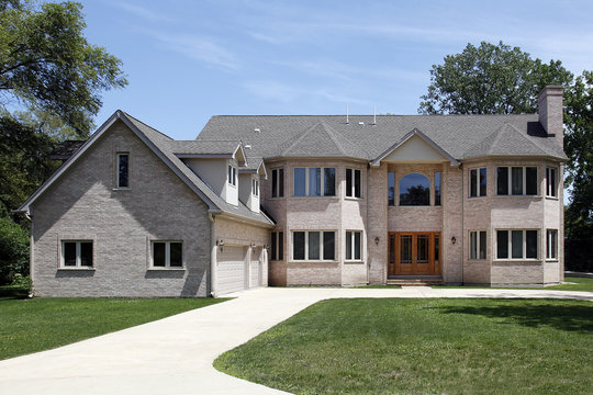 Large brick home with three car garage