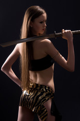 beautiful woman with a sword in the studio