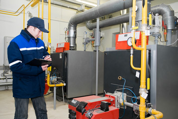 heating engineer in boiler room