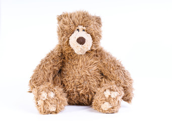 Brown bear toy isolated on white