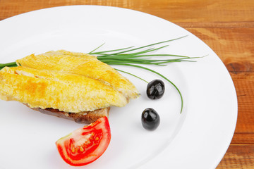 fish fillet with greek olives and tomatoes