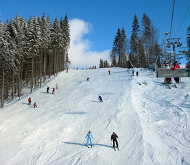 Ski track with chair lift in the mountains