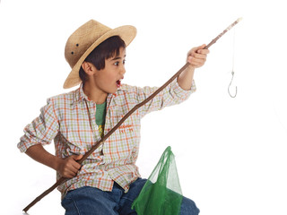 boy fishing amazed by the fish he caught