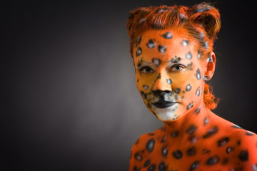 Woman painted as leoparde
