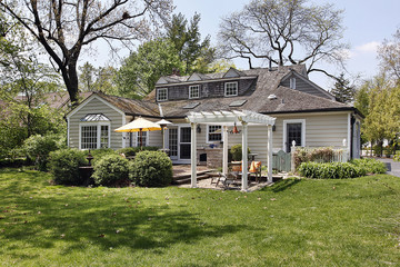 Home with back yard pergola